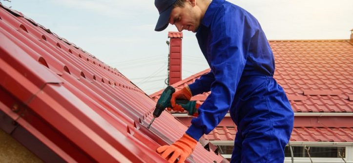 How Expert Roofers Clean and Repaint Metal Roofs