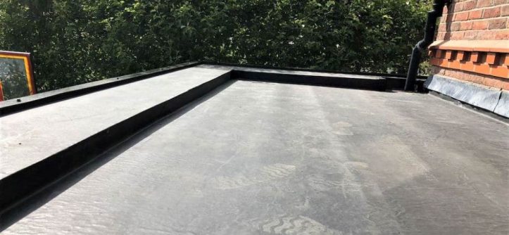 A concrete balcony coated with a shiny liquid waterproofing membrane to prevent leaks