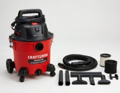 Craftsman CMXEVBE17250 wet dry vacuum with hose and attachments on a table.