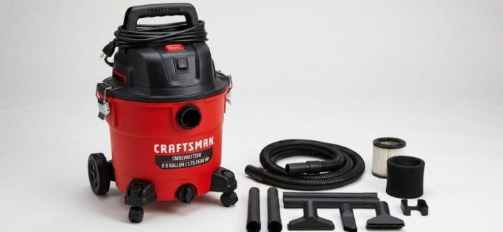 Craftsman CMXEVBE17250 wet dry vacuum with hose and attachments on a table.