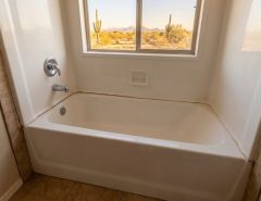 securing freestanding acrylic tub to tile floor