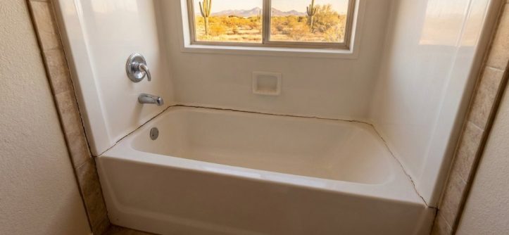 securing freestanding acrylic tub to tile floor